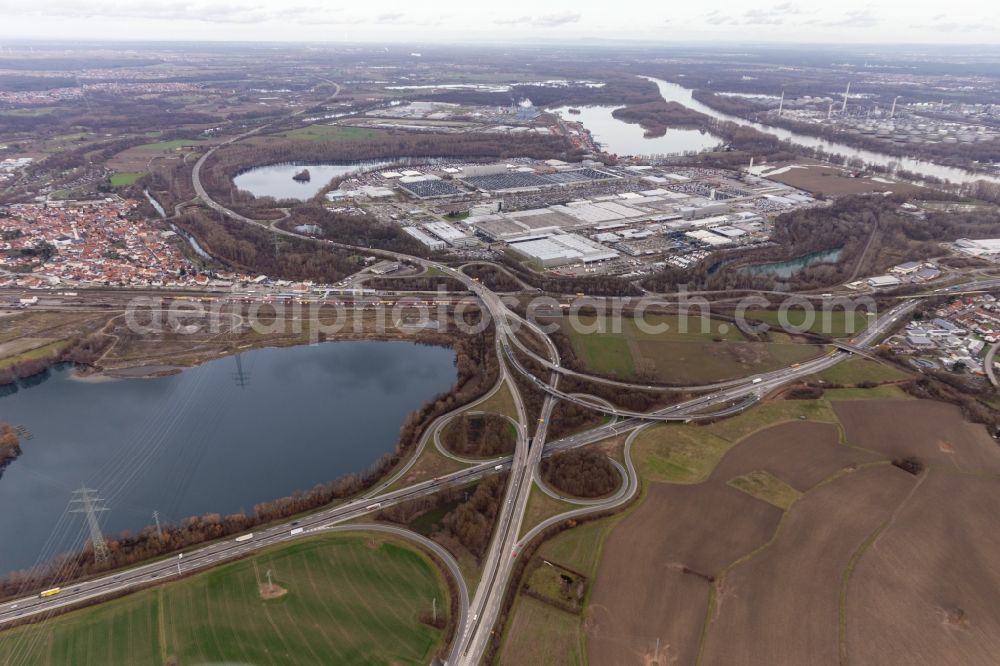 Aerial image Wörth am Rhein - Building and production halls on the premises of the Daimler Truck AG behind the Schaeuffele gravel lake at the Woerth junction of the A65 in Woerth am Rhein in the state Rhineland-Palatinate, Germany