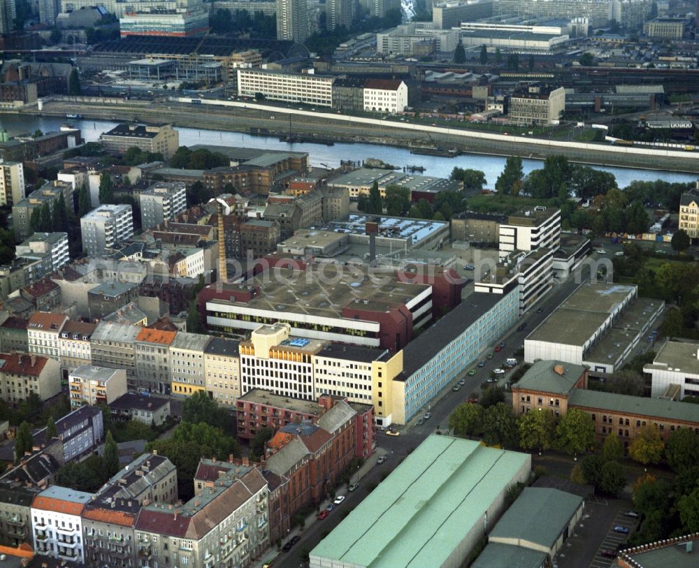 Berlin from above - Building and production halls on the premises of Deutsche Telefonwerk GmbH - DeTeWe Communications GmbH on Wrangelstrasse corner Zeughofstrasse in the district Kreuzberg in Berlin, Germany