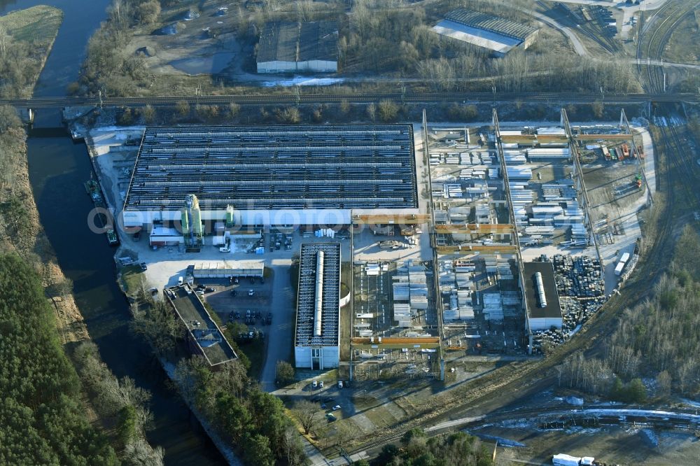 Hennigsdorf from the bird's eye view: Building and production halls on the premises of of Palex Paletten Express & Logistics GmbH on Veltener Strasse in Hennigsdorf in the state Brandenburg, Germany