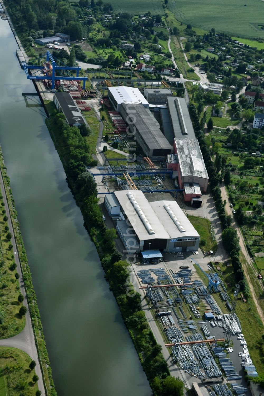 Elbe-Parey from the bird's eye view: Building and production halls on the premises of of Wiegel Parey GmbH & Co. KG on Genthiner Strasse in the district Parey in Elbe-Parey in the state Saxony-Anhalt, Germany