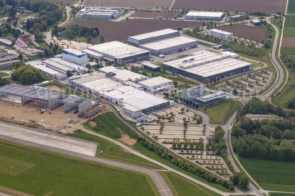 Laupheim from the bird's eye view: Building and production halls on the premises of Diehl-Aviation Am Flugplatz in the district Untersulmetingen in Laupheim in the state Baden-Wurttemberg, Germany