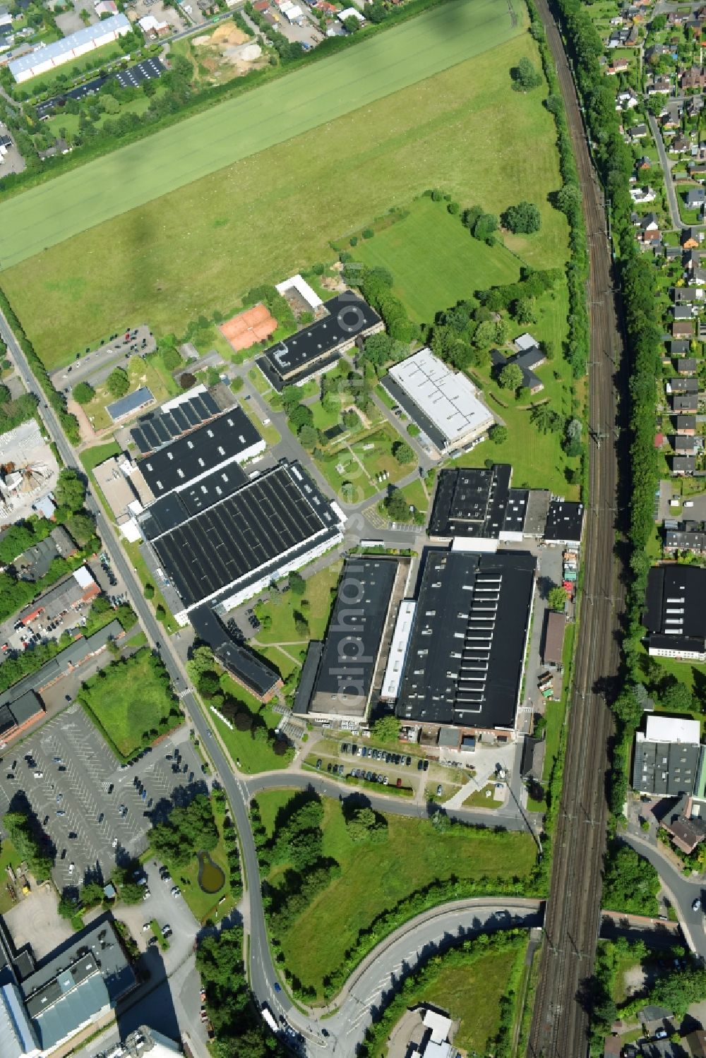 Schwarzenbek from above - Building and production halls on the premises of Fette Compacting GmbH along the Grabauer Strasse in Schwarzenbeck in the state Schleswig-Holstein, Germany