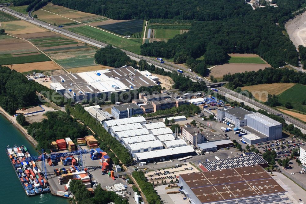 Weil am Rhein from the bird's eye view: Building and production halls with the Expansion building on the premises of Firma ARaymond in Weil am Rhein in the state Baden-Wuerttemberg