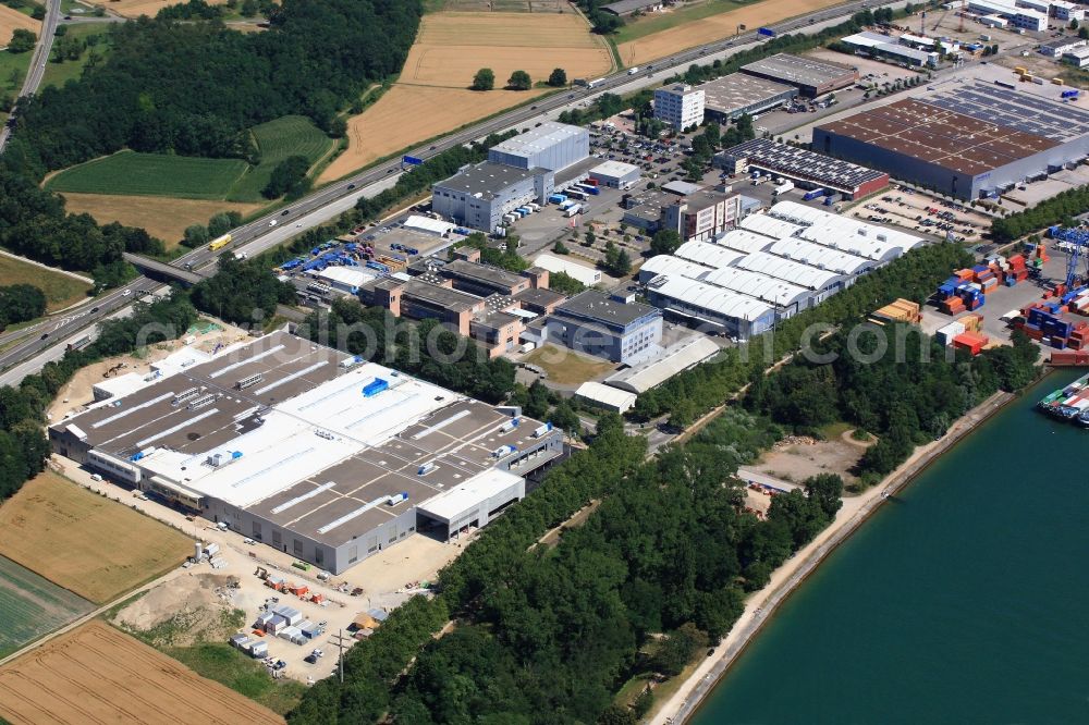 Aerial image Weil am Rhein - Building and production halls with the Expansion building on the premises of Firma ARaymond in Weil am Rhein in the state Baden-Wuerttemberg