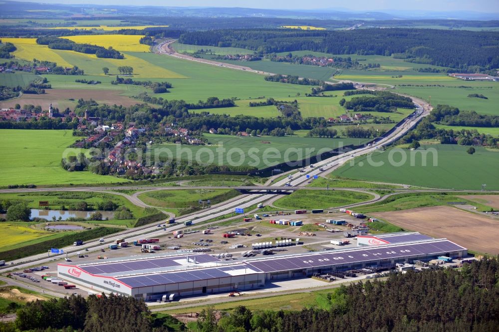 Triptis from the bird's eye view: Manufacturing location of utility vehicle company Fliegl at Oberpoellnitzer Strasse in town Triptis, Thuringia. Fliegl-group has domestic and abroad production sites for vehicle construction, structural engineering and agricultural engineering. It is one of the biggest companies of this type in Germany