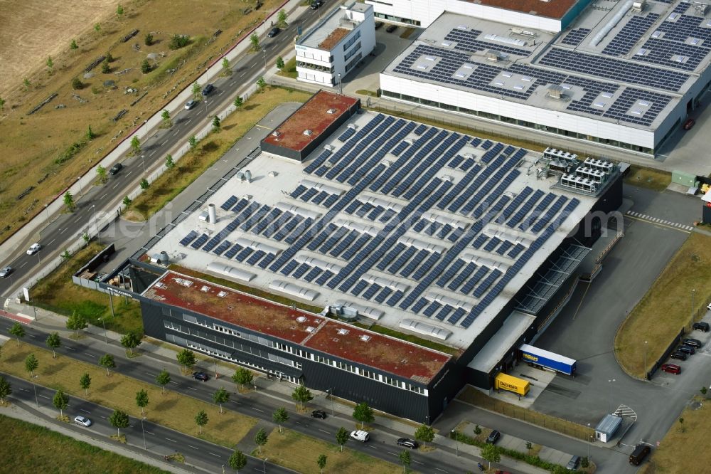 Aerial photograph Berlin - Building and production halls on the premises of Freudenberg Dichtungs- and Schwingungstechnik GmbH on Gross-Berliner Donm in the district Adlershof in Berlin, Germany