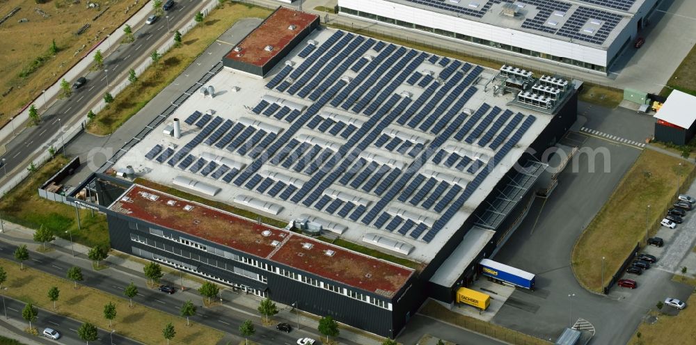 Berlin from above - Building and production halls on the premises of Freudenberg Dichtungs- and Schwingungstechnik GmbH on Gross-Berliner Donm in the district Adlershof in Berlin, Germany