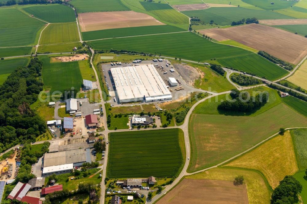 Diemelstadt from the bird's eye view: Building and production halls on the premises of Frima Prima Welle on Laubacher Weg in Diemelstadt in the state Hesse, Germany