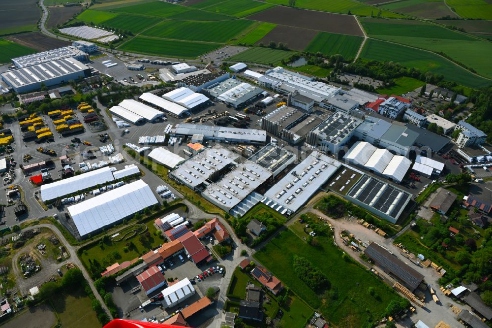 Aerial photograph Königsberg in Bayern - Building and production halls on the premises FRAeNKISCHE Rohrwerke Gebr. Kirchner GmbH & Co. KG on street Stoeckacher Weg in Koenigsberg in Bayern in the state Bavaria, Germany