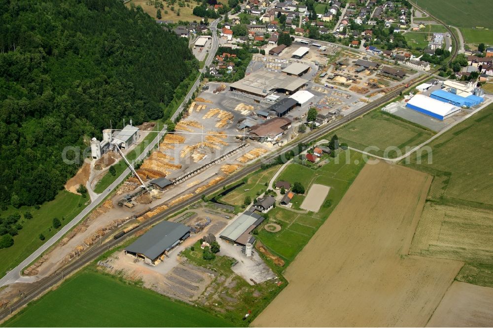 Liebenfels from the bird's eye view: Buildings and production halls on the HASSLACHER NORICA TIMBER - HASSLACHER Group site on Bahnhofstrasse in Liebenfels in Carinthia, Austria