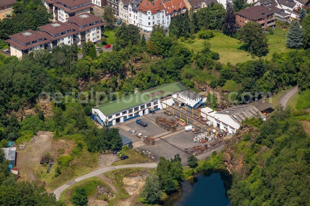 Mülheim an der Ruhr from the bird's eye view: Building and production halls on the premises of Hermann Rauen GmbH & Co. am Steinbruch Rauen in Muelheim on the Ruhr in the state North Rhine-Westphalia