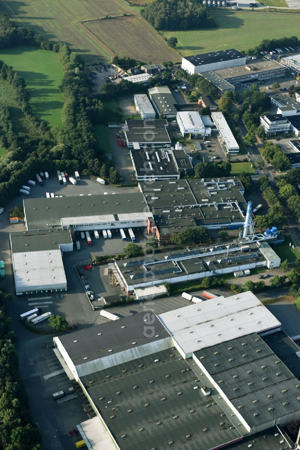 Schenefeld from the bird's eye view: Building and production halls on the premises of Hermes Schleifmittel GmbH & CO. KG on Osterbrooksweg in Schenefeld in the state Schleswig-Holstein