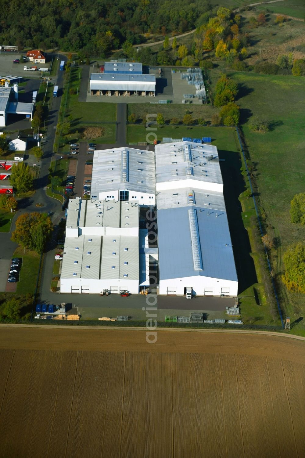 Burg from above - Building and production halls on the premises of High Tech Color Eloxal- and Pulverbeschichtungswerk GmbH on Erlenweg in the district Guetter in Burg in the state Saxony-Anhalt, Germany