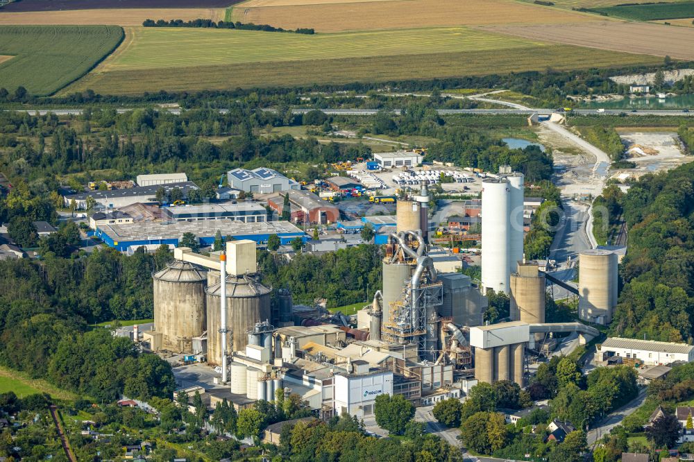 Beckum from the bird's eye view: Building and production halls on the premises of Holcim WestZement GmbH in Beckum in the state North Rhine-Westphalia, Germany