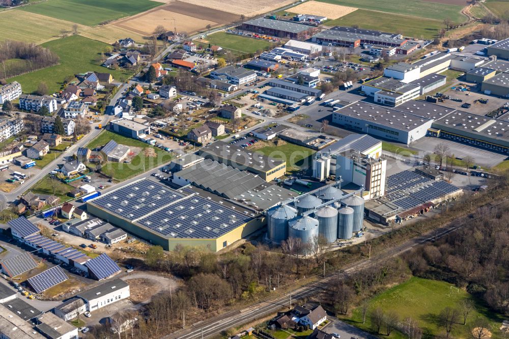 Werl from above - Building and production halls on the premises of Knauf Aluminiumwerks and the Warengenossenschaft Raiffeisen on street Zur Mersch - Am Grueggelgraben in Werl at Ruhrgebiet in the state North Rhine-Westphalia, Germany