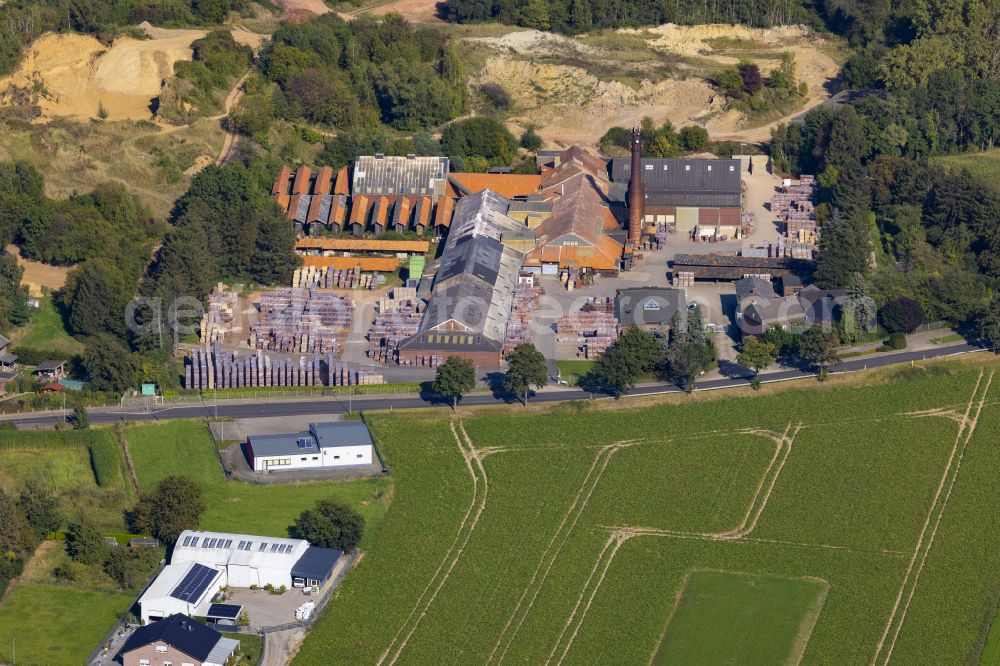 Körrenzig from above - Buildings and production halls for brick and clinker works on the factory premises of Coenen GmbH & Co. KG on Glimbacher Strasse in Linnich district of Koerrenzig in the federal state of North Rhine-Westphalia, Germany