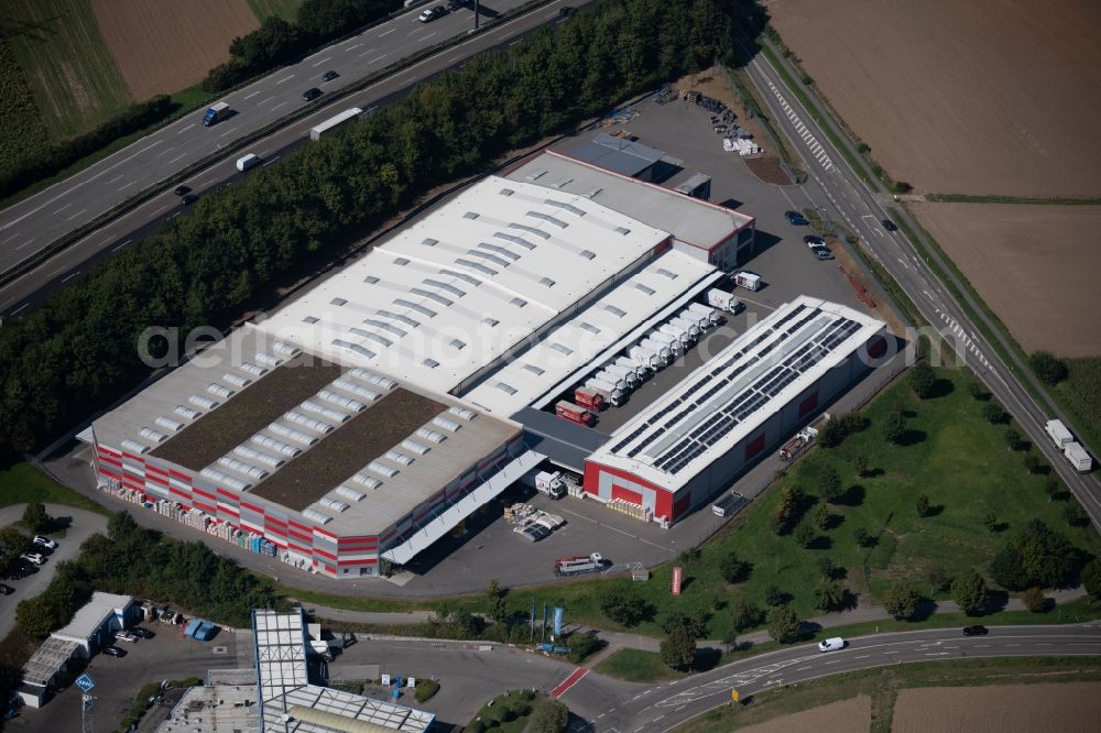 Ilsfeld from the bird's eye view: Building and production halls on the premises of LOeFFELHARDT Heilbronn GmbH at the Hauptstrasse in Ilsfeld in the state Baden-Wurttemberg, Germany