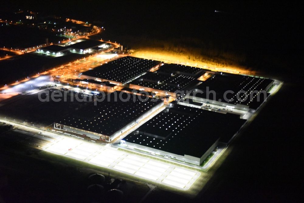 Kölleda from the bird's eye view: Night view Building and production halls on the premises of MDC Power GmbH on Rudolf-Caracciola-Strasse in Koelleda in the state Thuringia