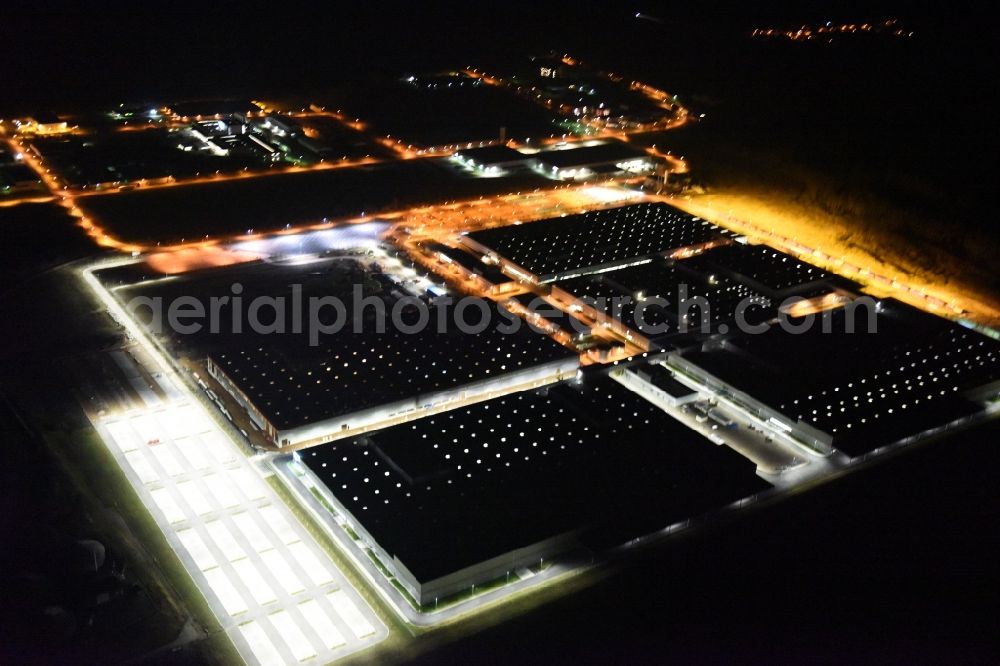 Aerial image Kölleda - Night view Building and production halls on the premises of MDC Power GmbH on Rudolf-Caracciola-Strasse in Koelleda in the state Thuringia