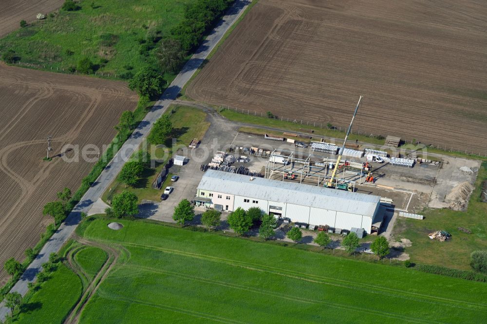 Schossin from the bird's eye view: Building and production halls on the premises of MGB Fliesen & Naturstein GmbH on street Warsower Strasse in Schossin in the state Mecklenburg - Western Pomerania, Germany