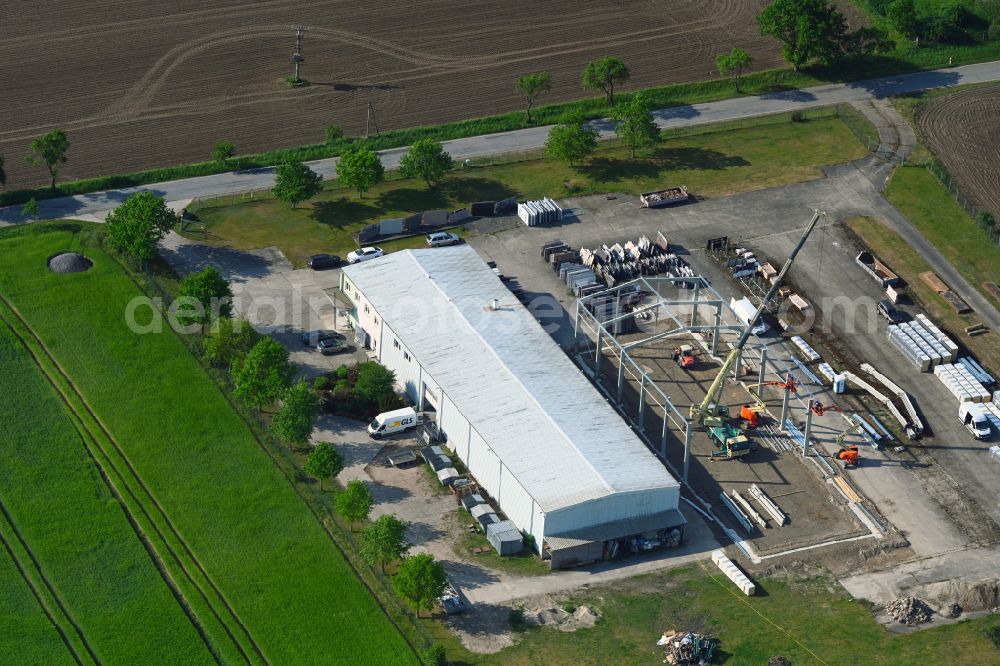 Aerial image Schossin - Building and production halls on the premises of MGB Fliesen & Naturstein GmbH on street Warsower Strasse in Schossin in the state Mecklenburg - Western Pomerania, Germany