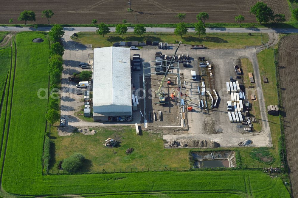 Aerial photograph Schossin - Building and production halls on the premises of MGB Fliesen & Naturstein GmbH on street Warsower Strasse in Schossin in the state Mecklenburg - Western Pomerania, Germany