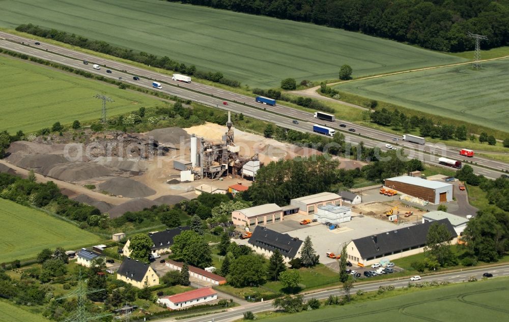 Weimar from the bird's eye view: Building and production halls on the premises of MHI Asphalt GmbH and the local Autobahnmeisterei - highway maintenance depot along the BAB4 in the district Legefeld in Weimar in the state Thuringia, Germany