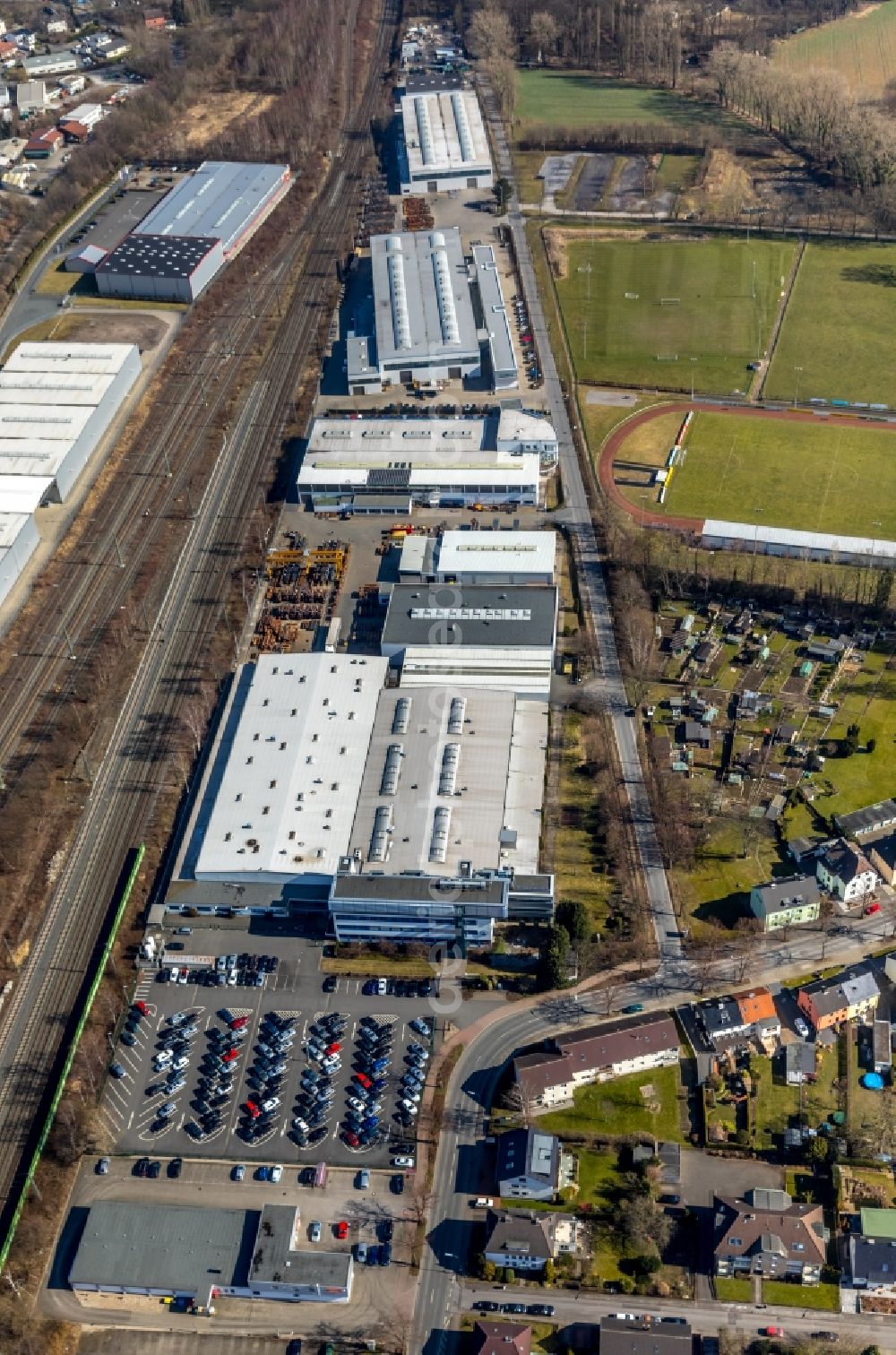 Holzwickede from the bird's eye view: Building and production halls on the premises of Montanhydraulik GmbH on Bahnhofstrasse in Holzwickede in the state North Rhine-Westphalia, Germany