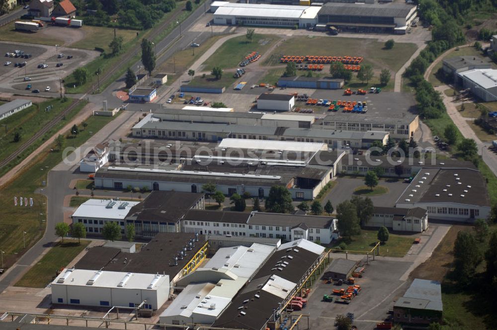 Waltershausen from the bird's eye view: Blick auf das Werksgelände der Multicar Spezialfahrzeuge GmbH in Waltershausen Thüringen. Multicar ist ein mittelständisches Unternehmen, das Geräteträger, sowie Transporter erzeugt. Ursprung der Firma liegt in der Gründung der ADE - Werke im Jahr 1920. Kontakt: Multicar Spezialfahrzeuge GmbH, Industriestraße 3, 99880 Waltershausen, Tel. +49(0)3622 640 0, Fax +49(0)3622 640 243, Email: info@multicar.de