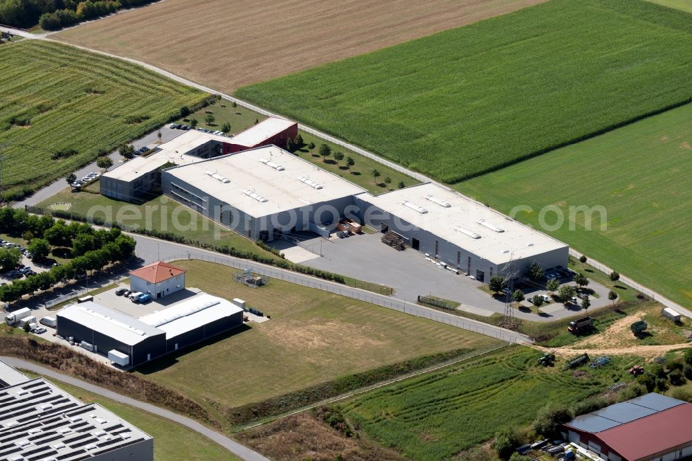 Grünsfeld from above - Building and production halls on the premises of OCTO Actuators GmbH in the De-Werth-Str. in Gruensfeld in the state Baden-Wurttemberg, Germany