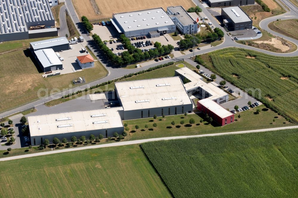 Grünsfeld from the bird's eye view: Building and production halls on the premises of OCTO Actuators GmbH in the De-Werth-Str. in Gruensfeld in the state Baden-Wurttemberg, Germany