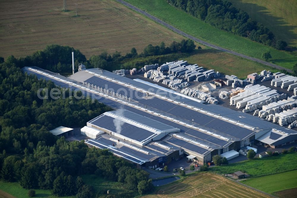 Bannberscheid from the bird's eye view: Building and production halls on the premises of Roeben Tonbaustoffe GmbH on Kirchstrasse in Bannberscheid in the state Rhineland-Palatinate, Germany