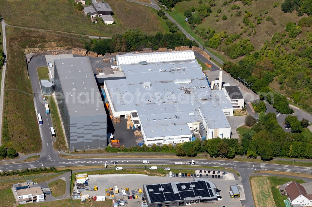 Grünsfeld from the bird's eye view: Building and production halls on the premises of Refresco Deutschland GmbH at the Roetensteinstrasse in Gruensfeld in the state Baden-Wurttemberg, Germany