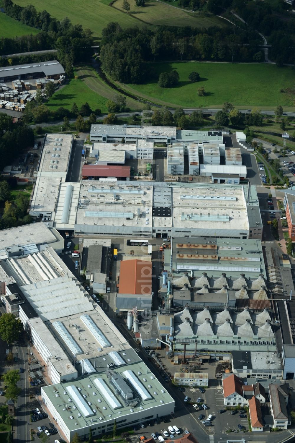 Lohr am Main from the bird's eye view: Building and production halls on the premises of Rexroth Guss Zum Eisengiesser in Lohr am Main in the state Bavaria