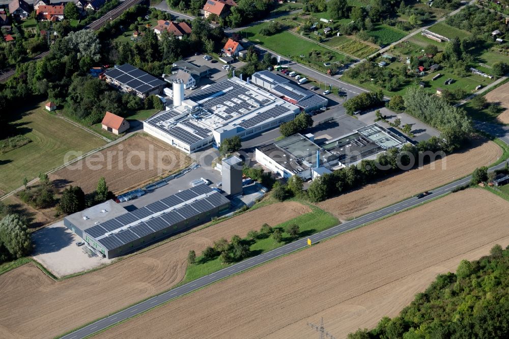 Aerial photograph Boxberg - Building and production halls on the premises of Schenk Fenstersysteme GmbH & Co KG overlooking a production building of the Hofmann Menue-Manufaktur GmbH at the Unterschuepfer Strasse in Boxberg in the state Baden-Wurttemberg, Germany