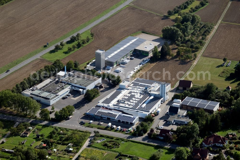 Boxberg from above - Building and production halls on the premises of Schenk Fenstersysteme GmbH & Co KG overlooking a production building of the Hofmann Menue-Manufaktur GmbH at the Unterschuepfer Strasse in Boxberg in the state Baden-Wurttemberg, Germany