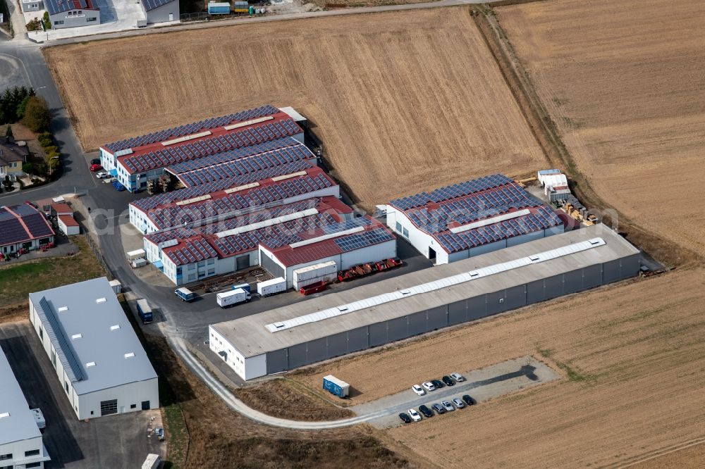 Aerial image Steinfeld - Building and production halls on the premises of SCHMELZMETALL Deutschland GmbH and of INHATEC GmbH & Co. KG on Raiffeisenstrasse in the district Hausen in Steinfeld in the state Bavaria, Germany