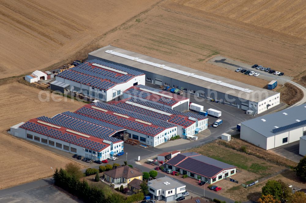 Steinfeld from above - Building and production halls on the premises of SCHMELZMETALL Deutschland GmbH and of INHATEC GmbH & Co. KG on Raiffeisenstrasse in the district Hausen in Steinfeld in the state Bavaria, Germany