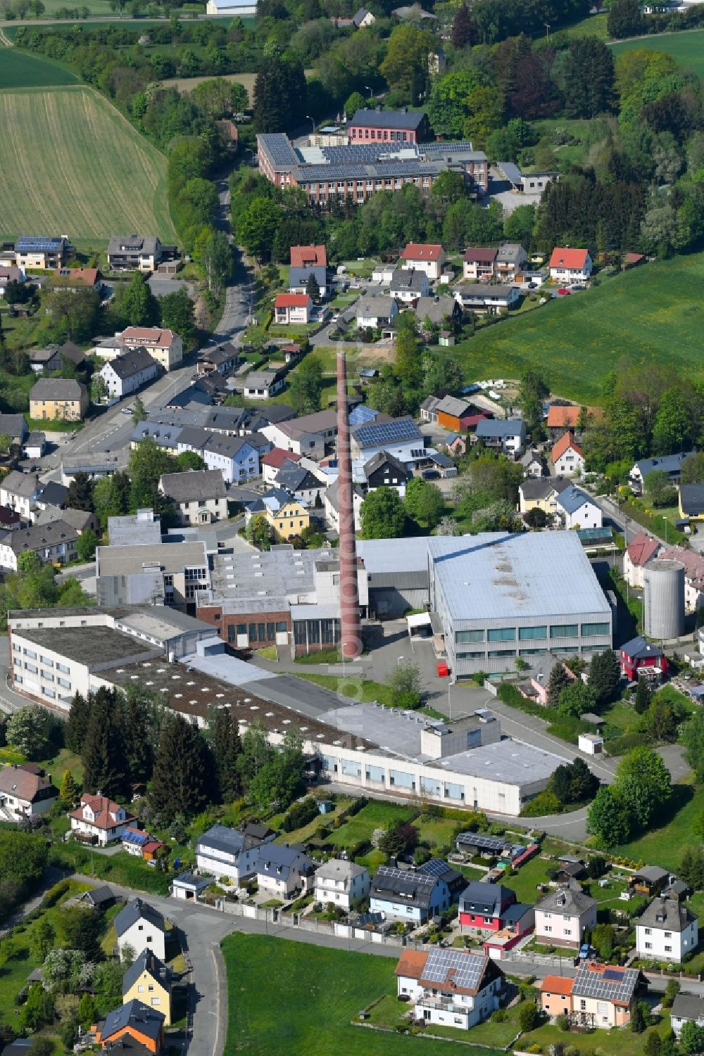 Aerial image Stammbach - Building and production halls on the premises of E. Schoepf GmbH & Co KG on Rathausstrasse in Stammbach in the state Bavaria, Germany