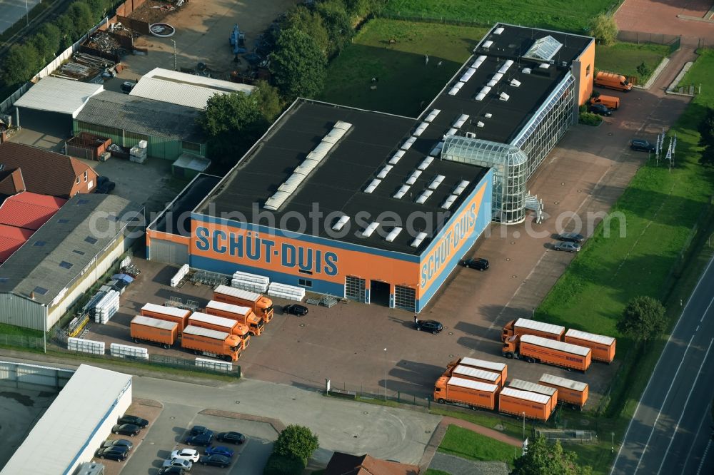 Aurich from the bird's eye view: Building and production halls on the premises of Schuet-Duis window and door technology GmbH u. Co. KG in the Liebigstrasse in Aurich in the state Lower Saxony