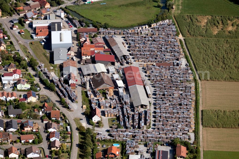 Hardthausen am Kocher from the bird's eye view: Building and production halls on the premises of the sawmill of Haeberlein GmbH Untere Au in Hardthausen am Kocher in the state Baden-Wurttemberg, Germany