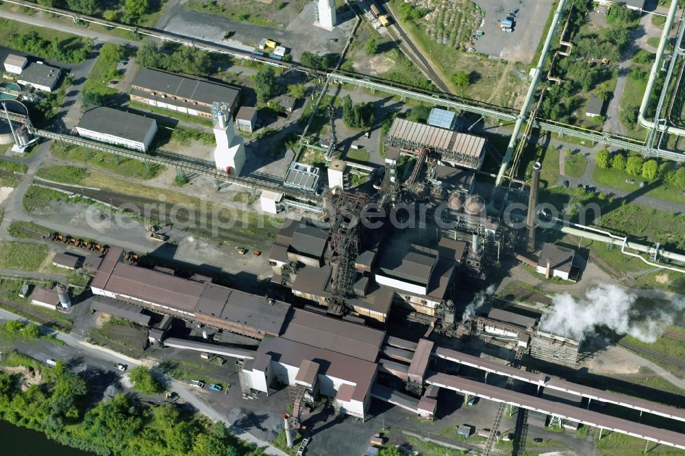 Eisenhüttenstadt from the bird's eye view: Building and production halls on the premises of steelworks ArcelorMittal in Eisenhuettenstadt in the state Brandenburg