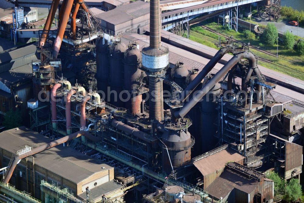 Aerial photograph Eisenhüttenstadt - View at the work site of the steel plant in Eisenhüttenstadt in the federal state of Brandenburg. Here to see a blast furnace. The former EKO steel plant is operated by the ArcelorMittal Group which is headquartered in Luxembourg