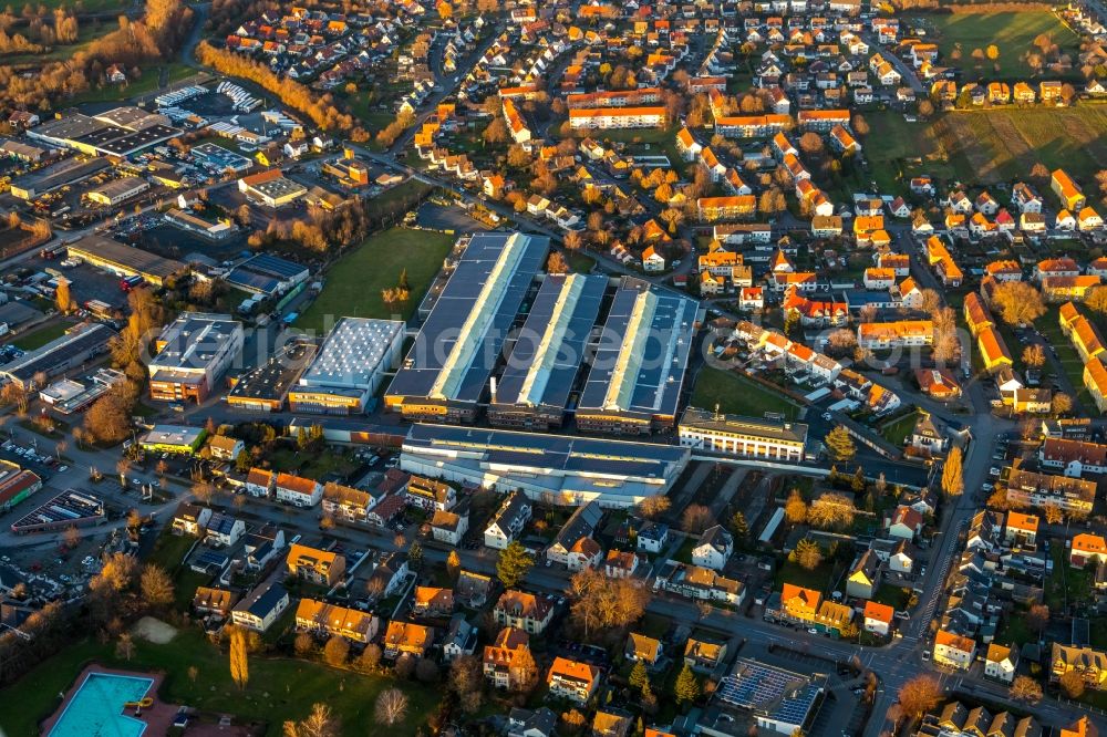 Aerial image Werl - Building and production halls on the premises Standard-Metallwerke GmbH nearby residential area on Rustigestrasse in Werl in the state North Rhine-Westphalia, Germany