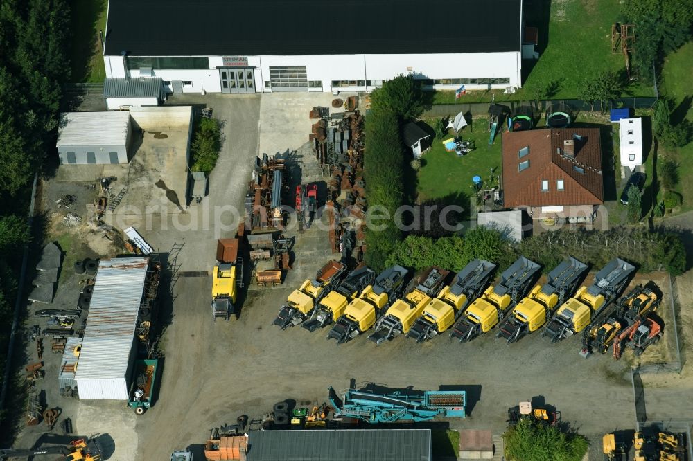 Aerial photograph Breitenfelde - Building and production halls on the premises of STRIMAK Baumaschinen und Kraftfahrzeuge GmbH an der Bergkoppel in Breitenfelde in the state Schleswig-Holstein