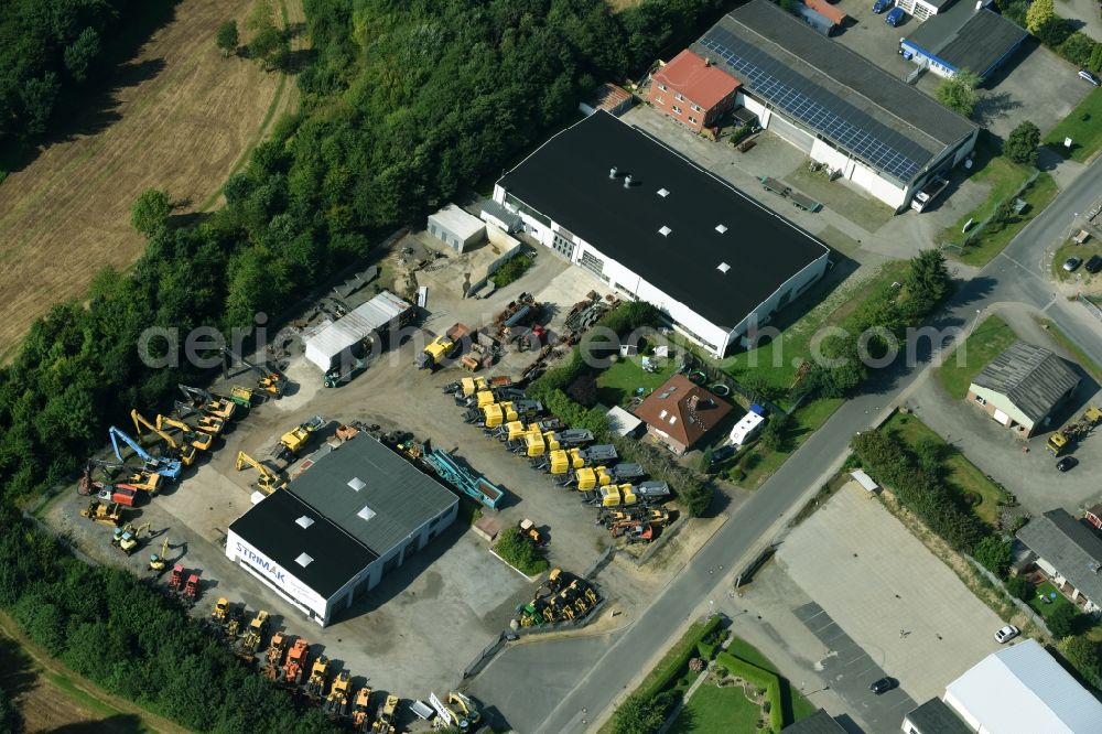 Breitenfelde from the bird's eye view: Building and production halls on the premises of STRIMAK Baumaschinen und Kraftfahrzeuge GmbH an der Bergkoppel in Breitenfelde in the state Schleswig-Holstein