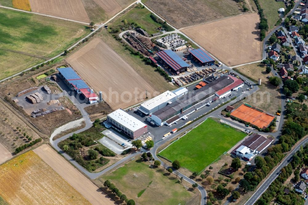 Gössenheim from the bird's eye view: Building and production halls on the premises of Systec System Anlagetechnik GmbH & Co.KG Am Sportplatz in Goessenheim in the state Bavaria, Germany