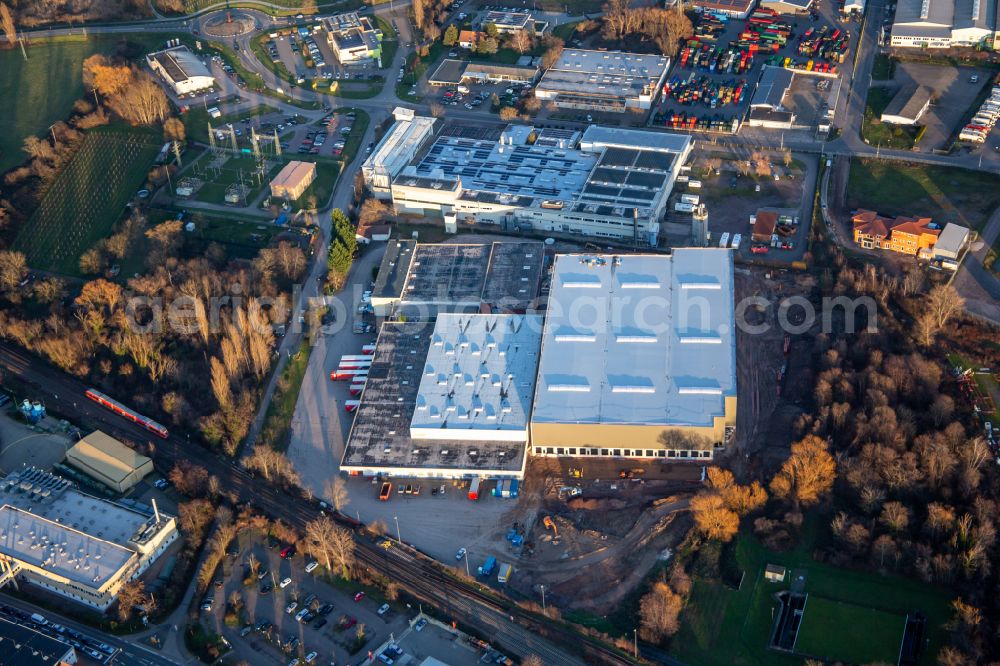 Edenkoben from the bird's eye view: Building and production halls on the premises of Tricor Packaging and Logistics AG, CONLOG GmbH & Co. KG and MAG Edenkoben GbR on street Venninger Strasse in Edenkoben in the state Rhineland-Palatinate, Germany