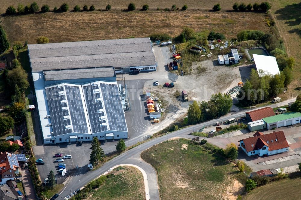 Aura im Sinngrund from above - Building and production halls on the premises of Viant Aura GmbH and of COVERIT EPDM-Abdichtungstechnik GmbH on Struthberg in the district Deutelbach in Aura im Sinngrund in the state Bavaria, Germany