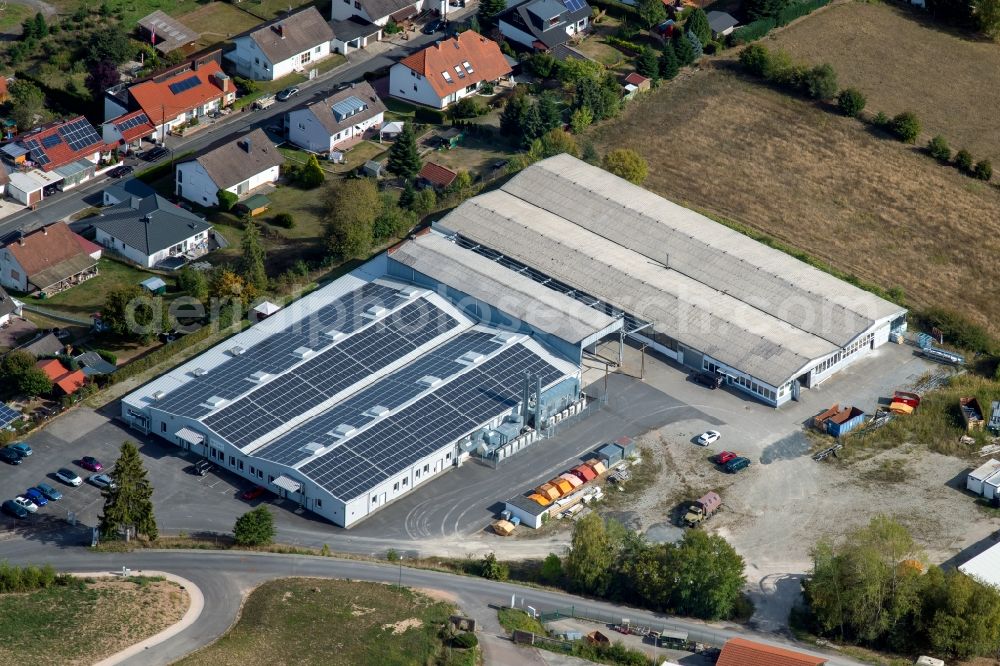 Aura im Sinngrund from the bird's eye view: Building and production halls on the premises of Viant Aura GmbH and of COVERIT EPDM-Abdichtungstechnik GmbH on Struthberg in the district Deutelbach in Aura im Sinngrund in the state Bavaria, Germany